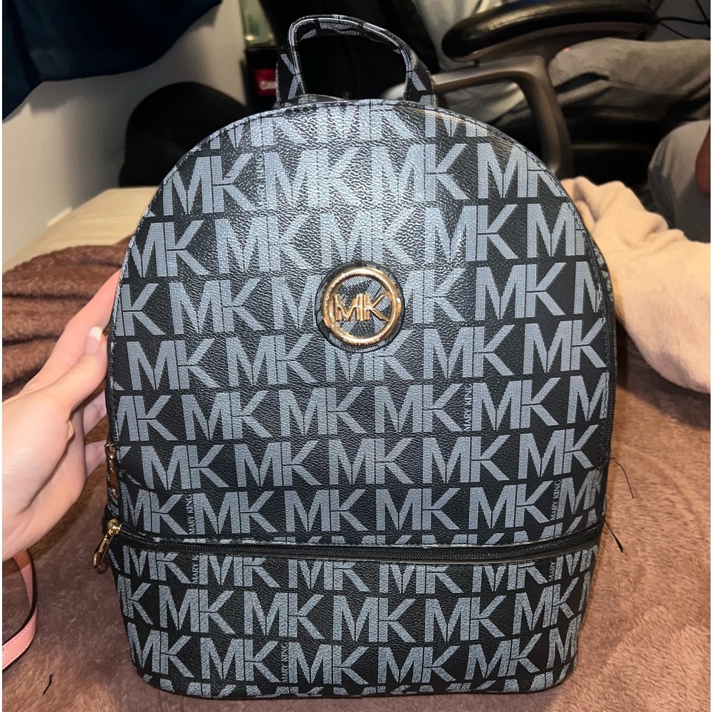 Black and grey Mary king backpack.
